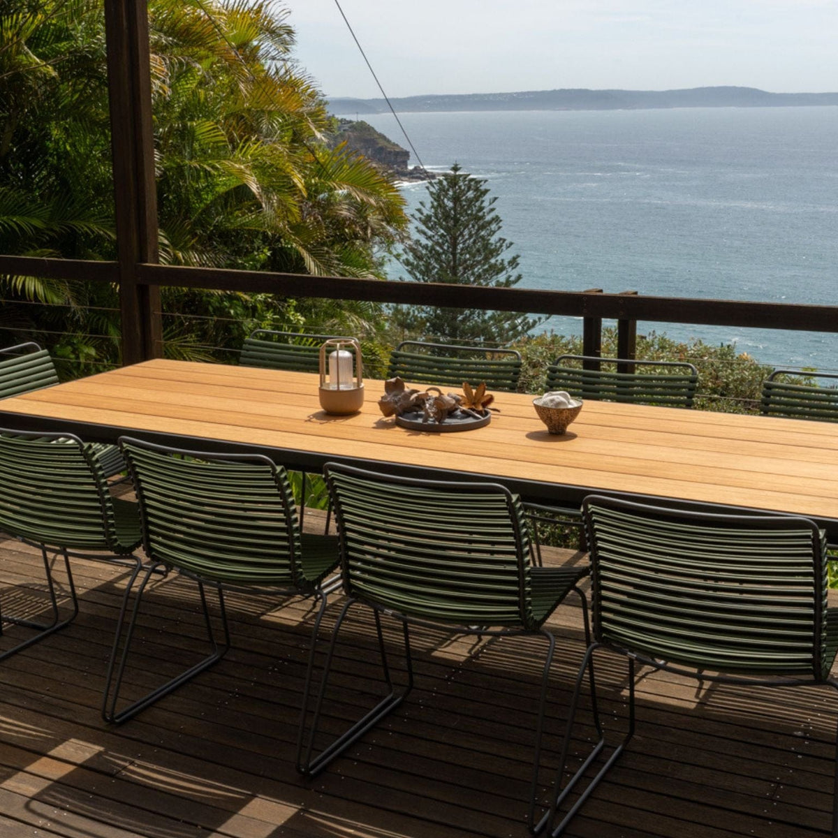 Green Click Four Dining Set overlooking ocean