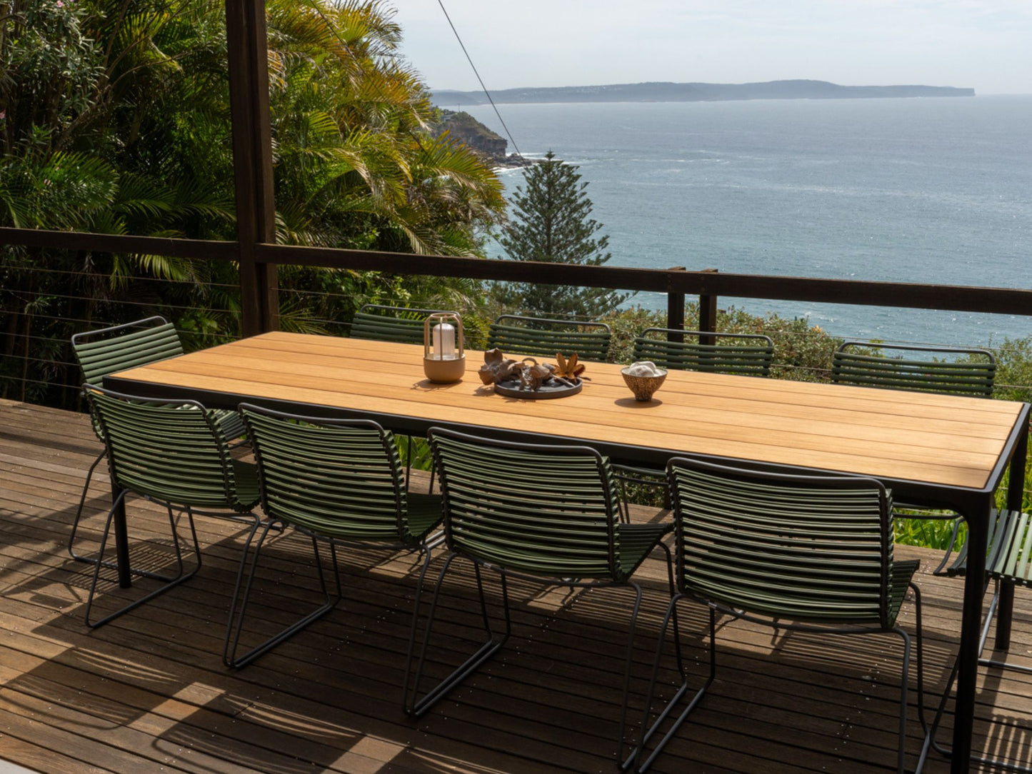 Green Click Four Dining Set overlooking ocean