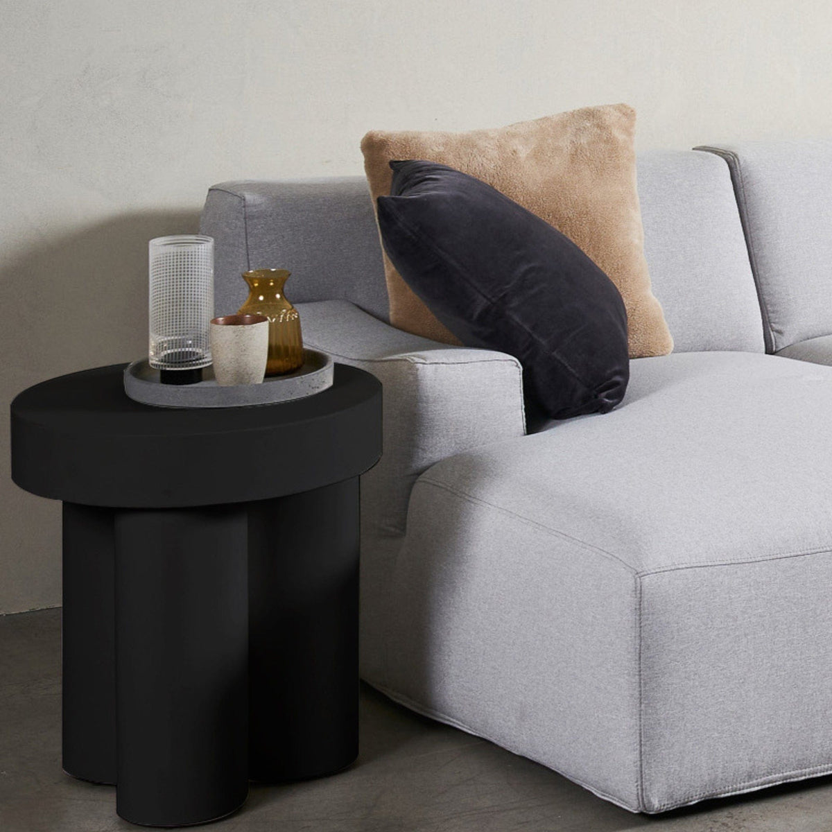Black side table with pillows on gray sofa - JTS037CB_2