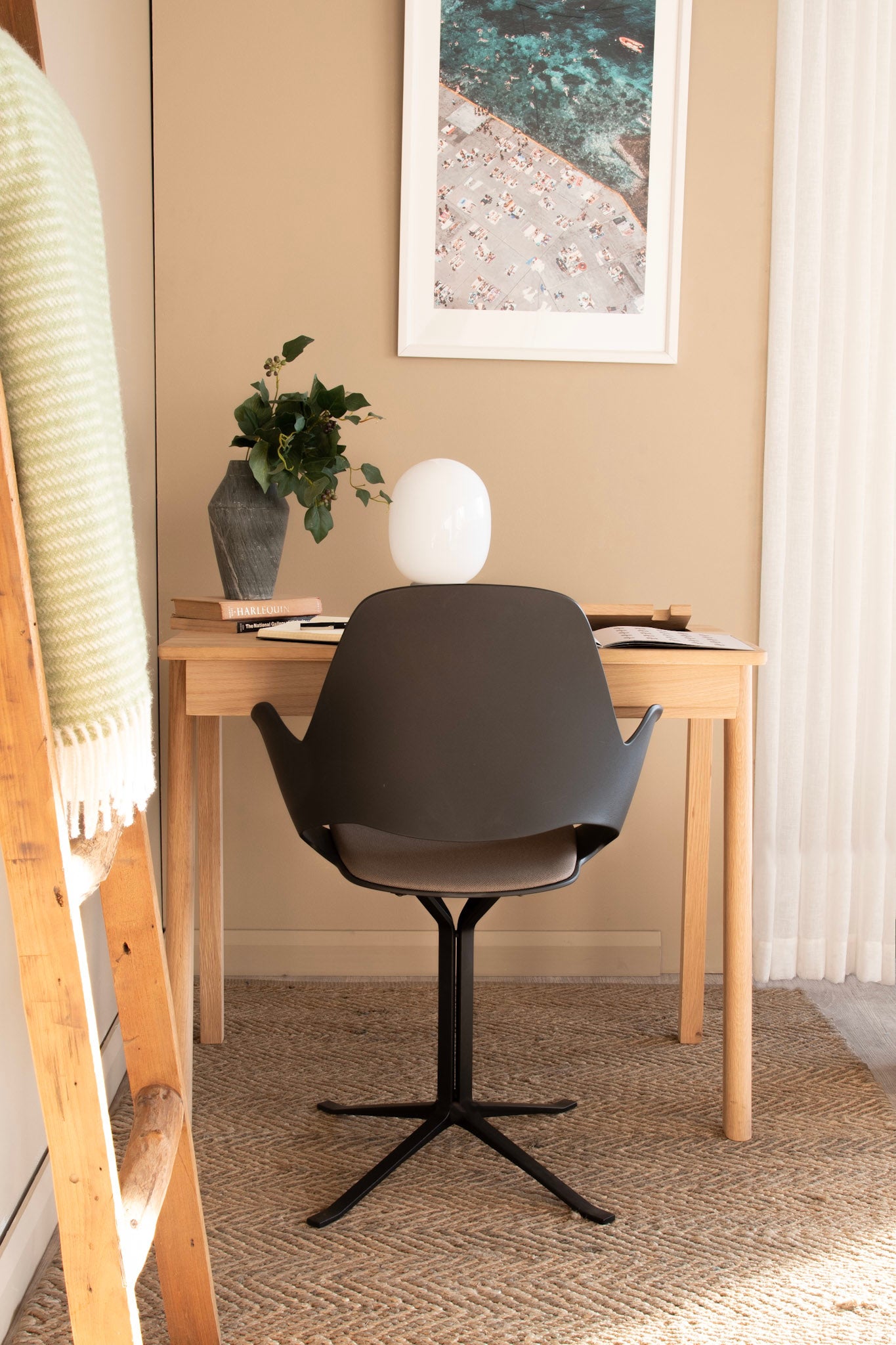 Desk setup with chair, artwork, and plant - KCC01O_04