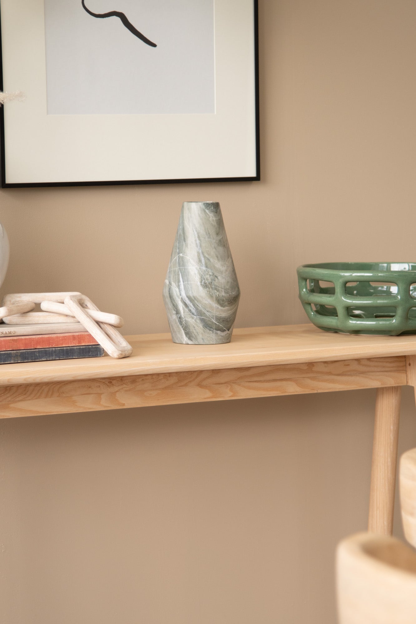 Marble vase on wooden console table