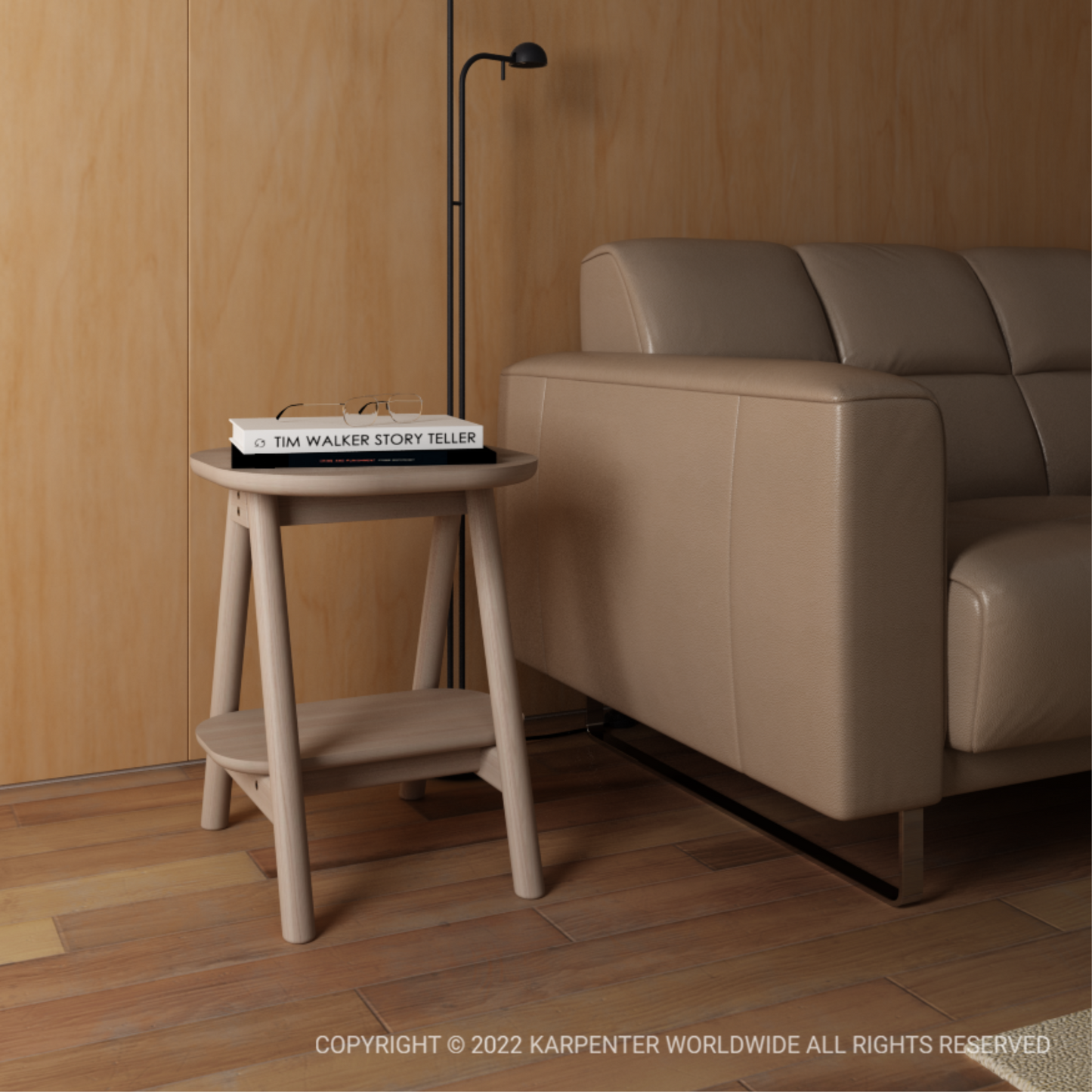 Small side table with book and beige sofa.