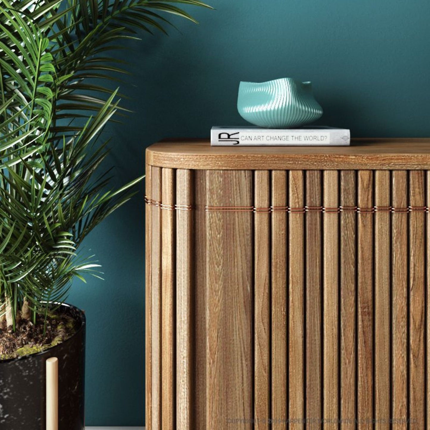 Wooden cabinet with decor, plant, and book.
