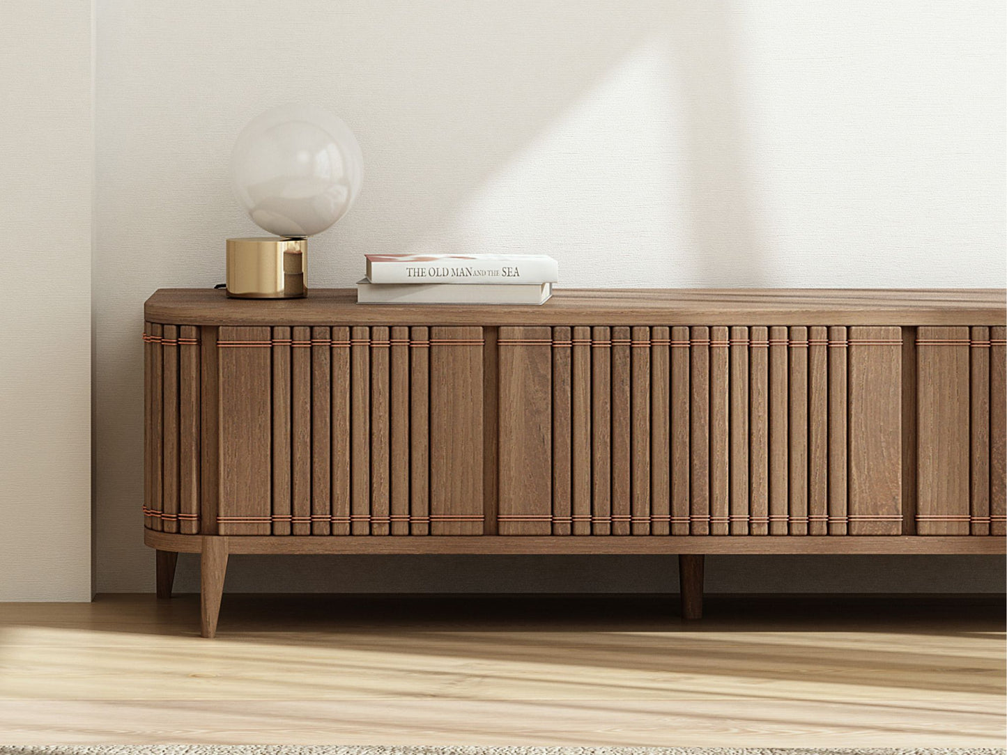 Wooden media console with lamp and books