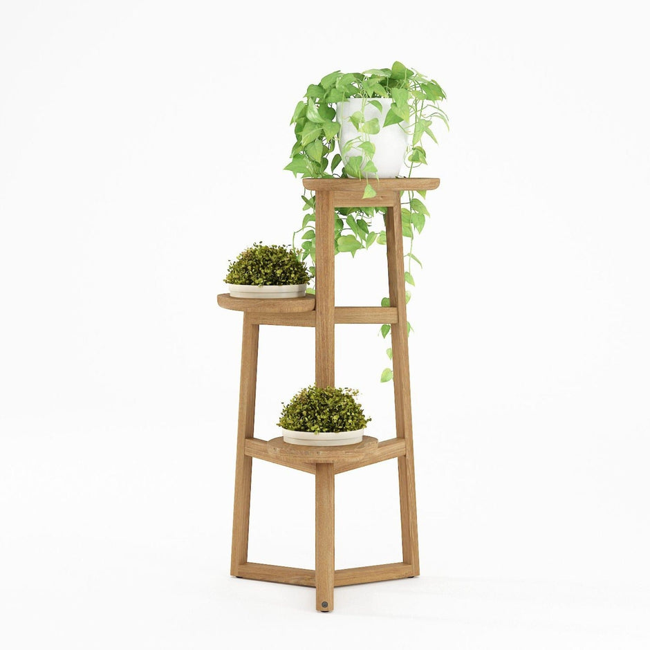 Wooden plant stand with three tiers and plants