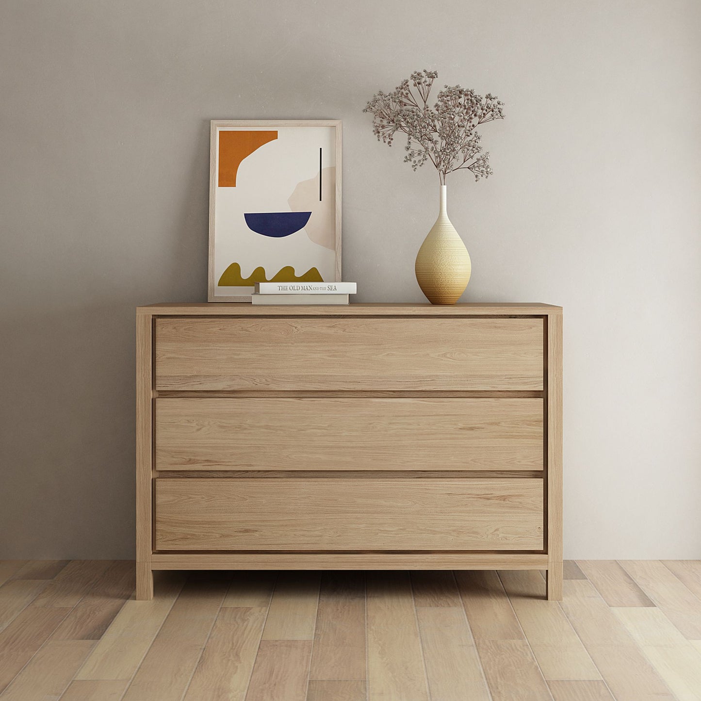 Modern wooden dresser with art and vase.