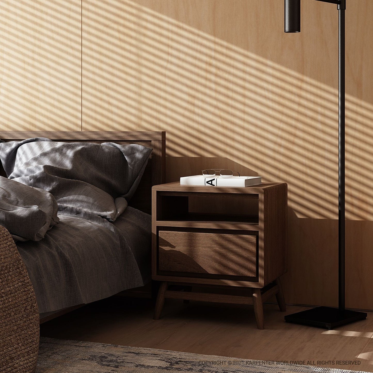 Wooden bedside table with lamp and book in a bedroom.