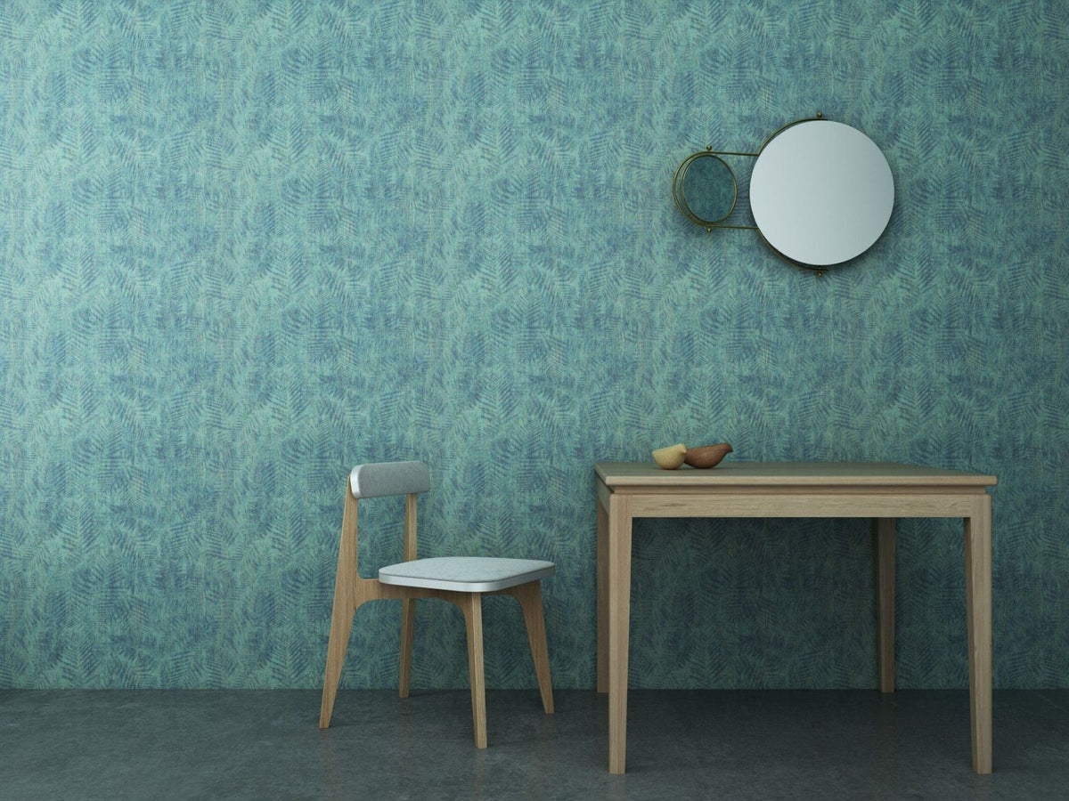 Interior with teal textured wall, table, chair, and mirror.