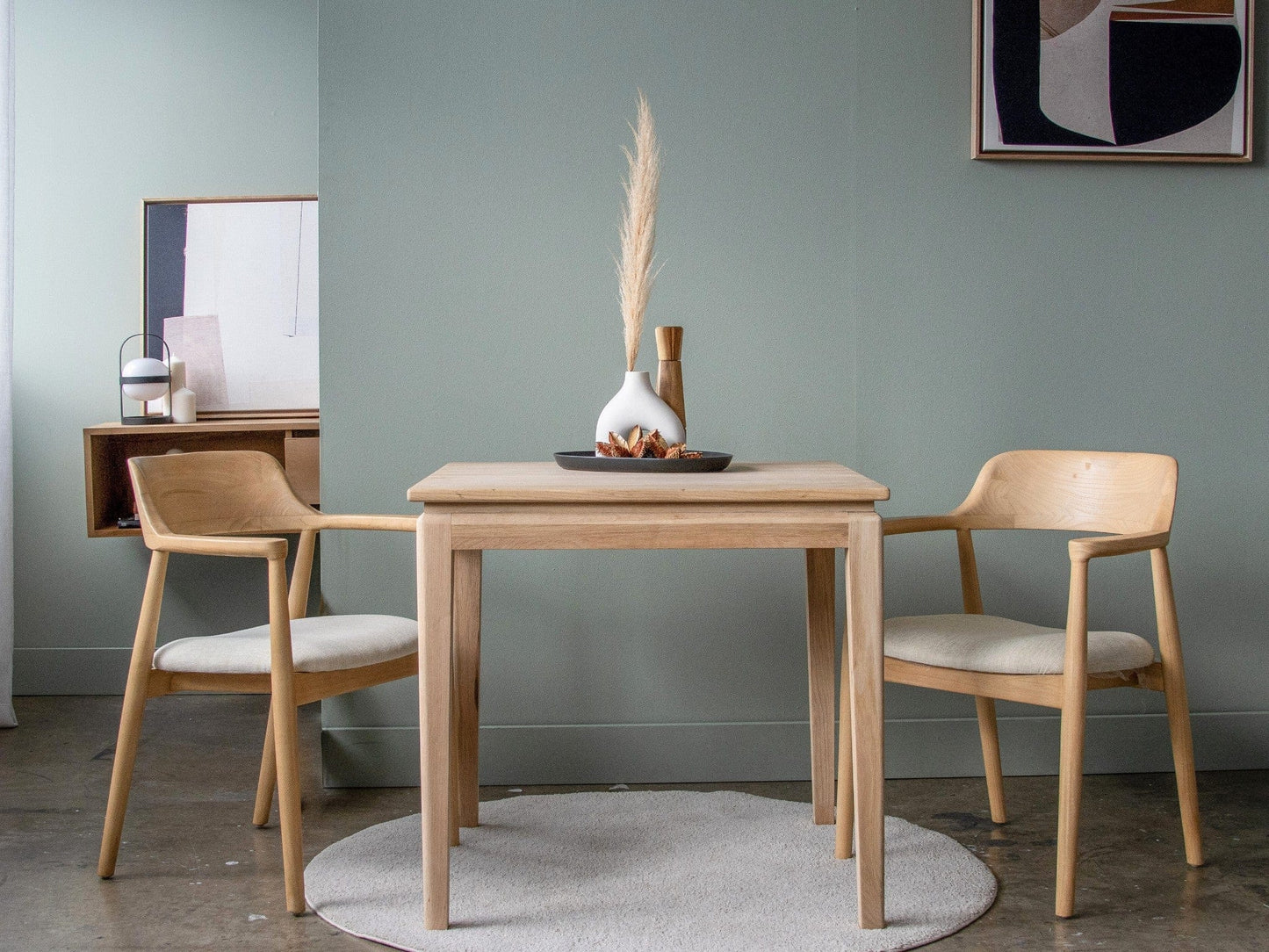 Wooden dining table with two chairs
