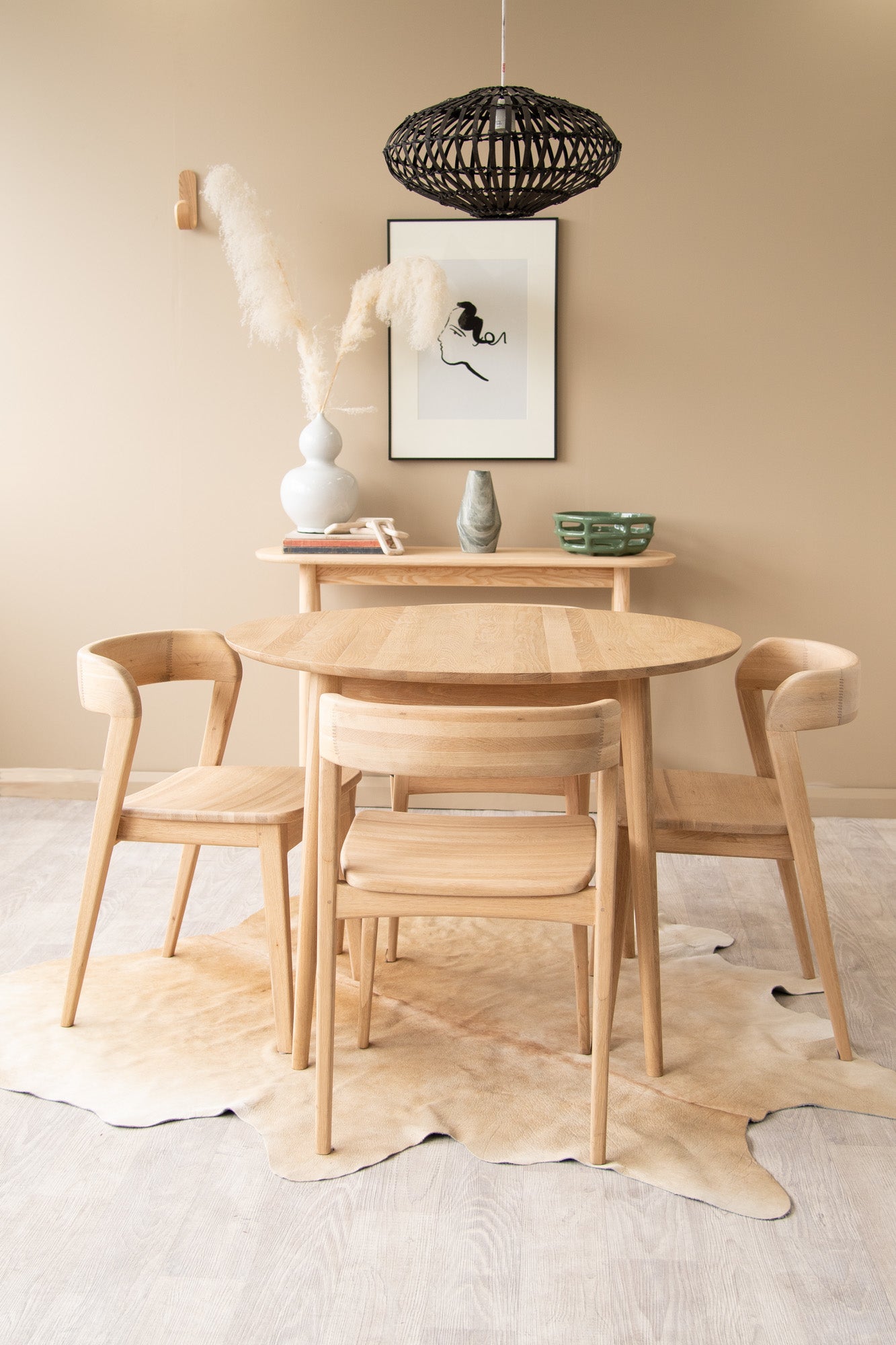 Wooden dining table and chairs in a modern interior.