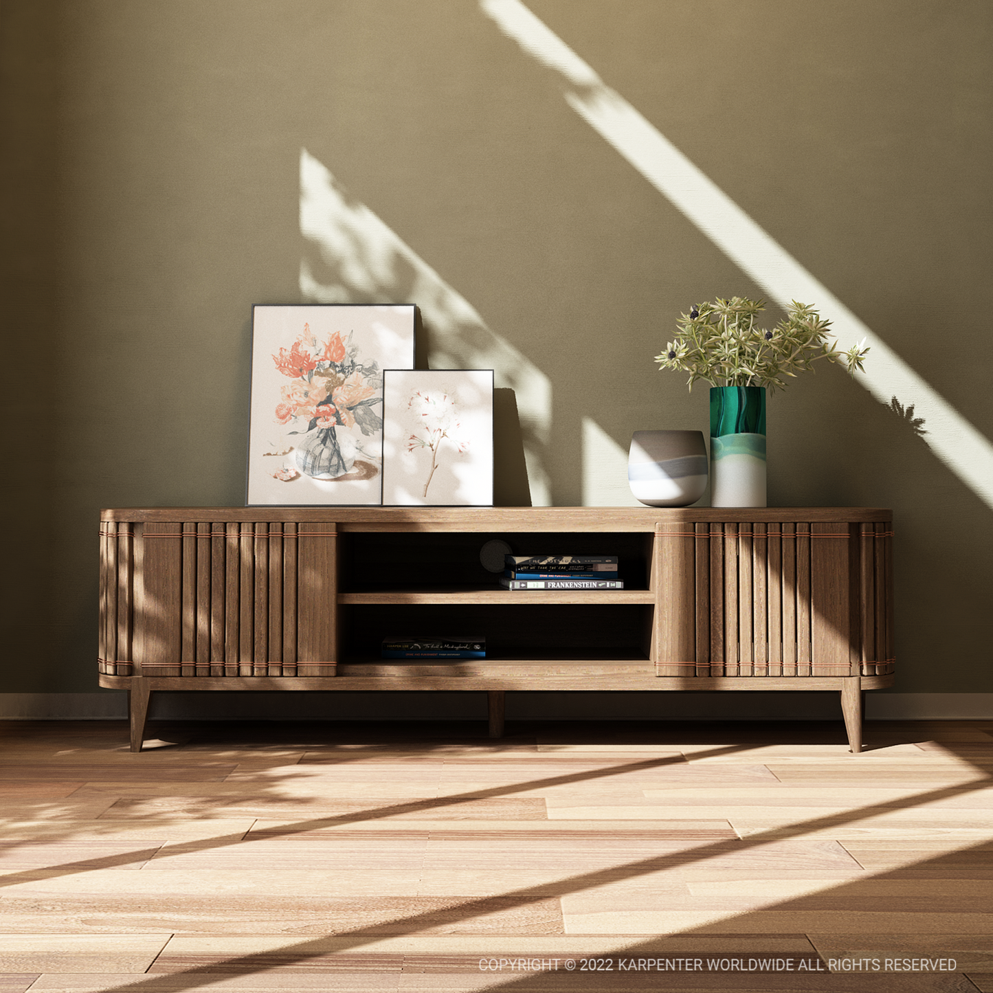 Koppar Media Cabinet with artwork and vase on a wooden cabinet.