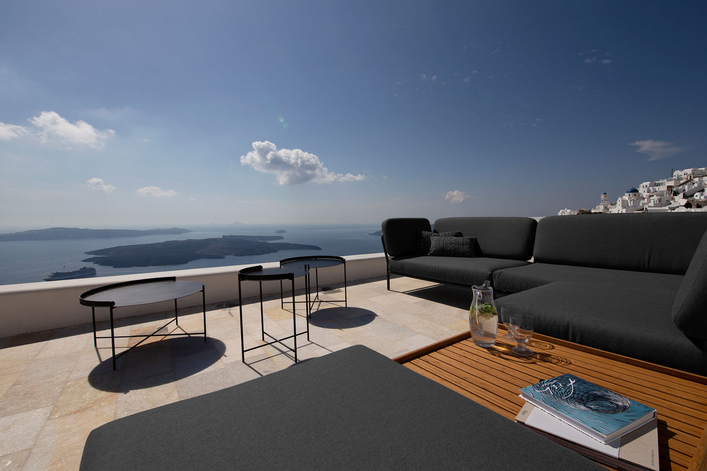 Sooty grey LEVEL outdoor furniture on black EDGE patio, HOUE design.