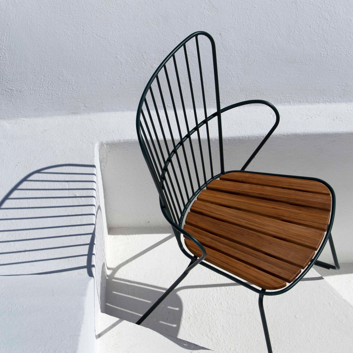 Modern outdoor chair with wooden seat on white background