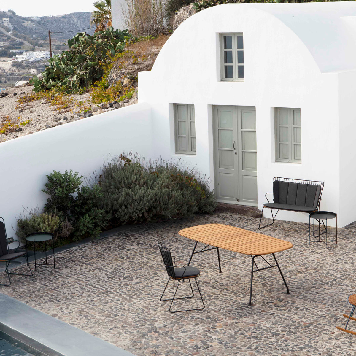 Outdoor furniture set in front of white building - MG_1589