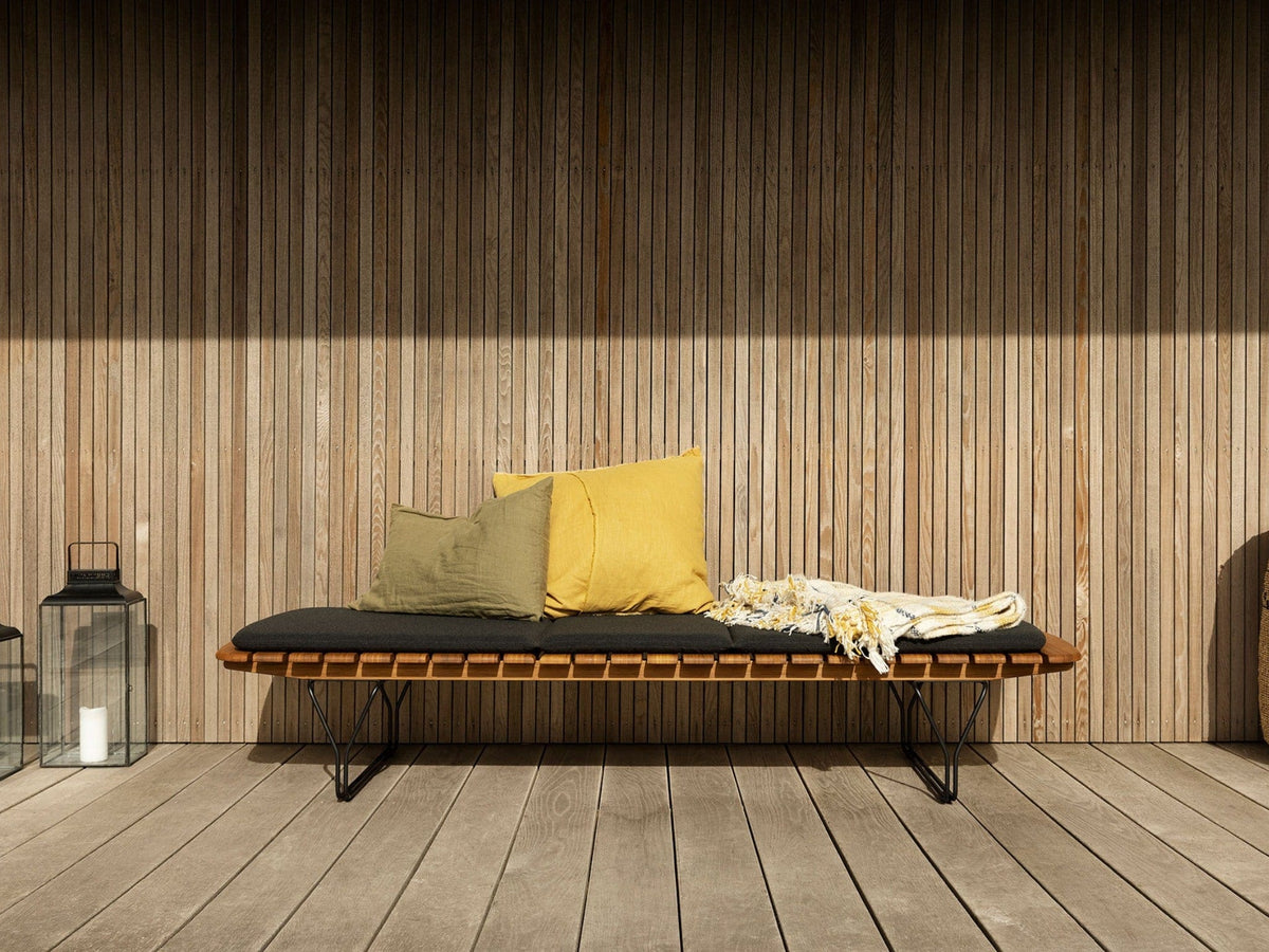Molo Charcoal bench with pillows on wooden deck