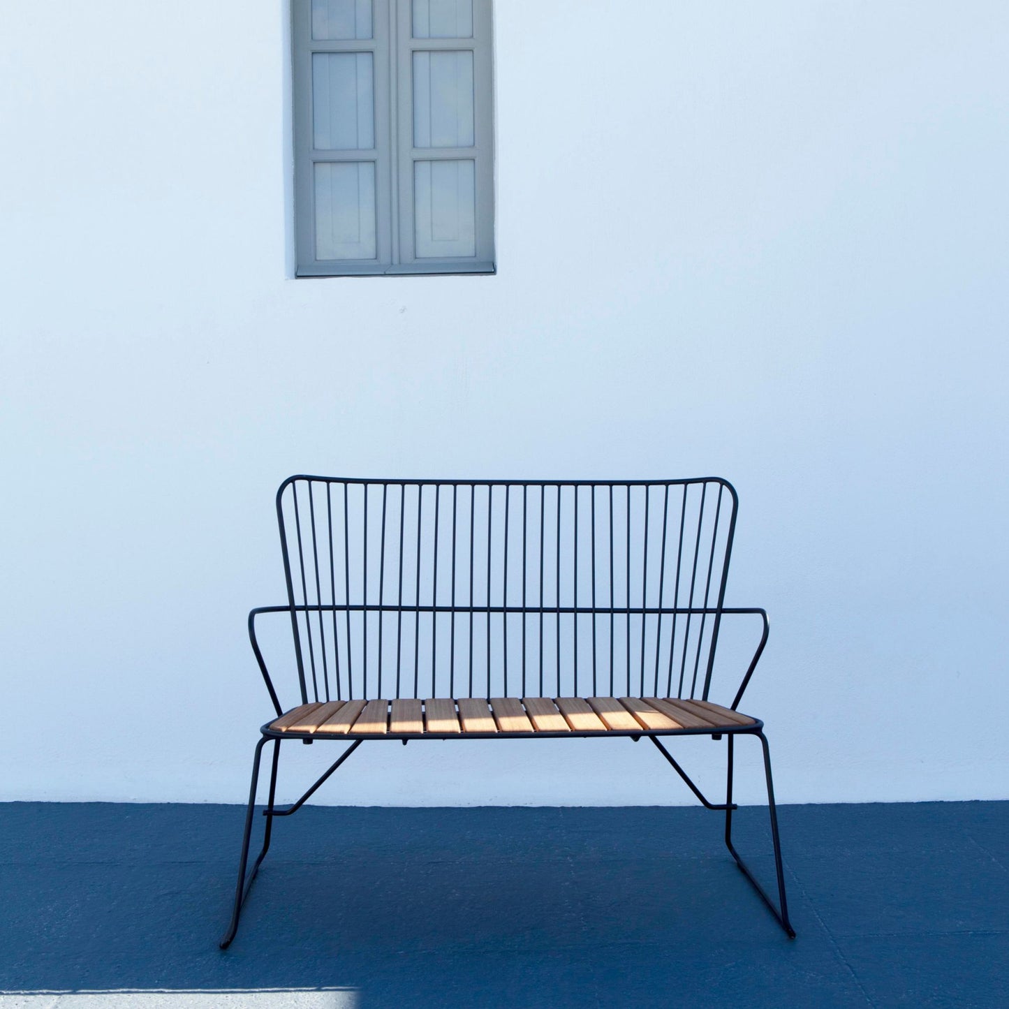 PAON bench with cushion against white wall