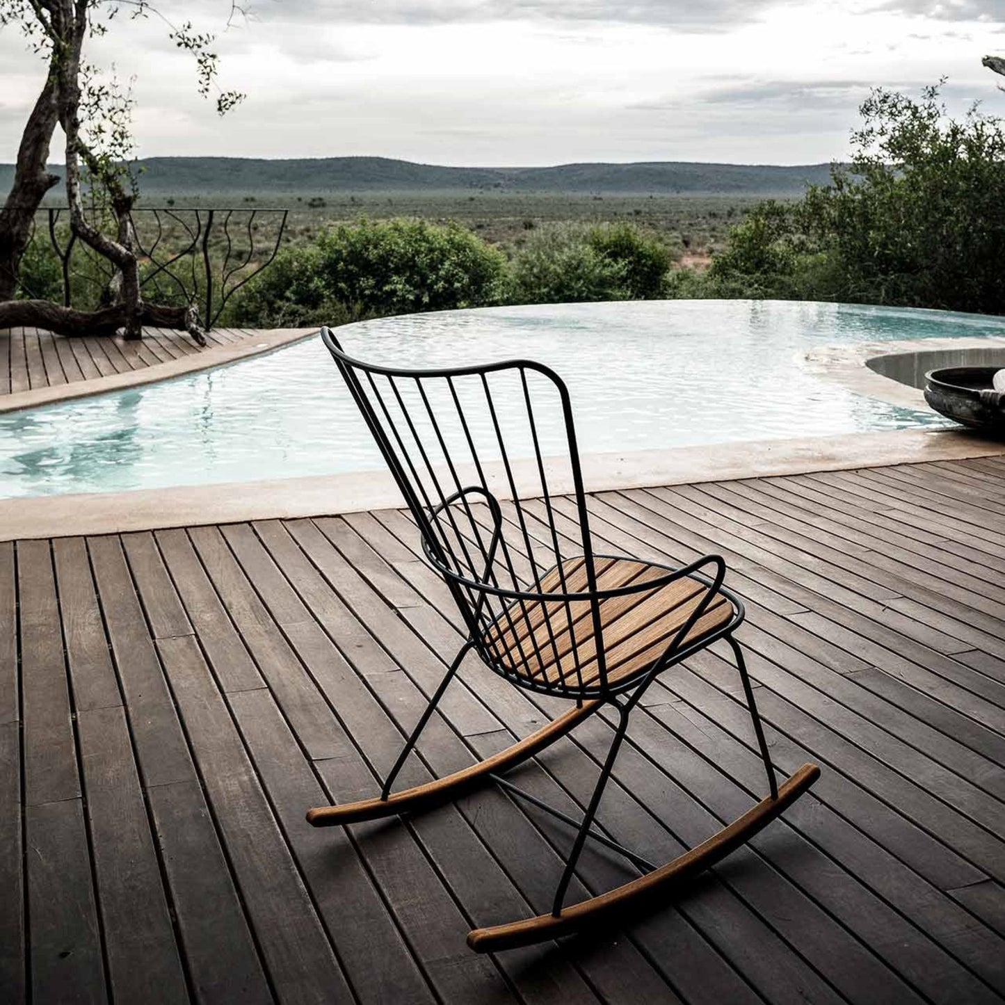 PAON rocking chair with cushion by pool