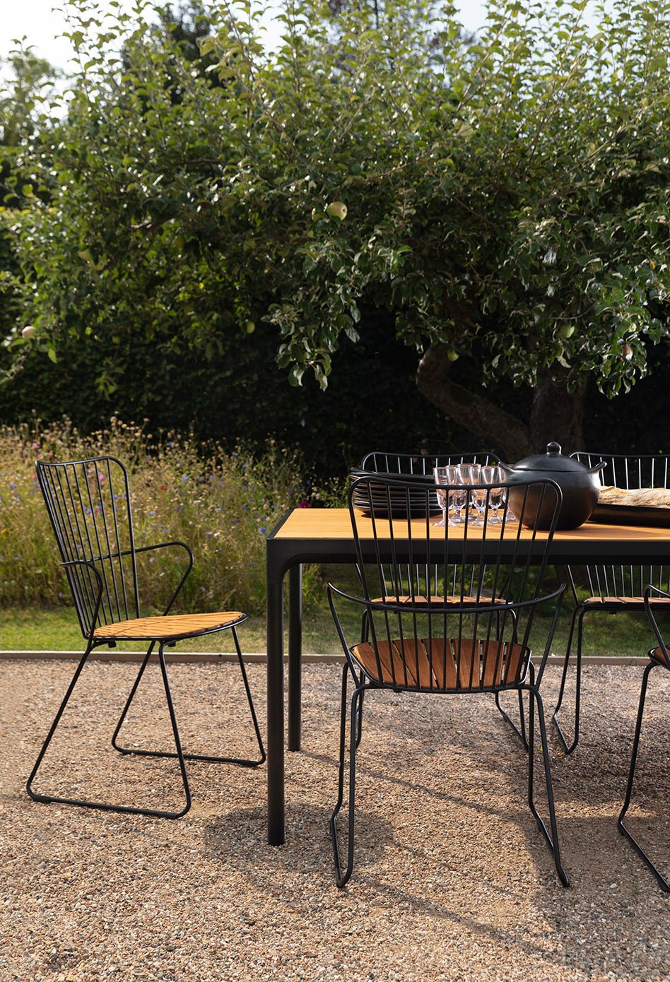 PAON black dining table with four bamboo chairs