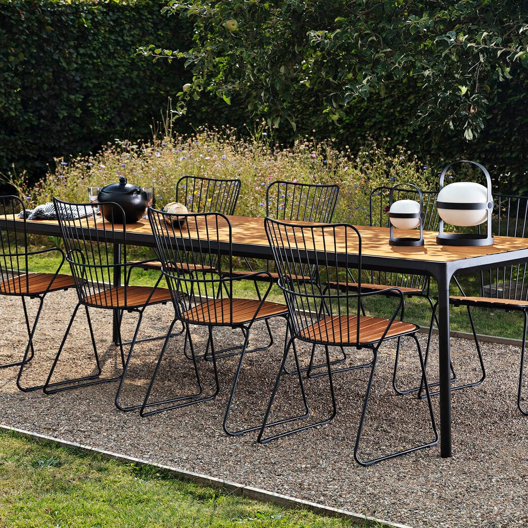 Black dining table set with bamboo chairs