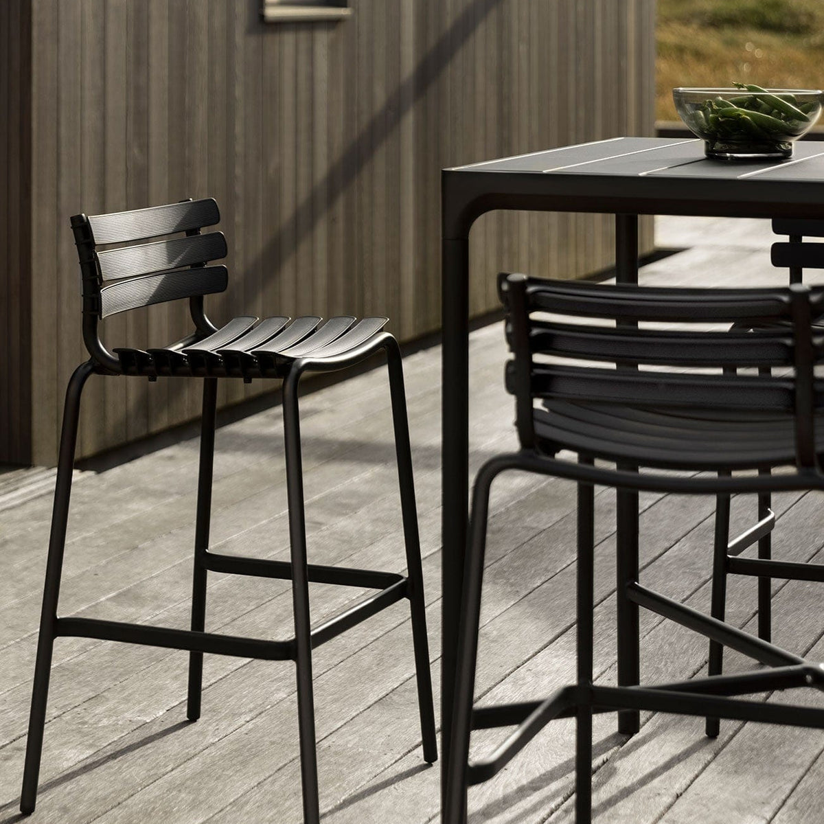 ReCLIPS black bar stools on deck