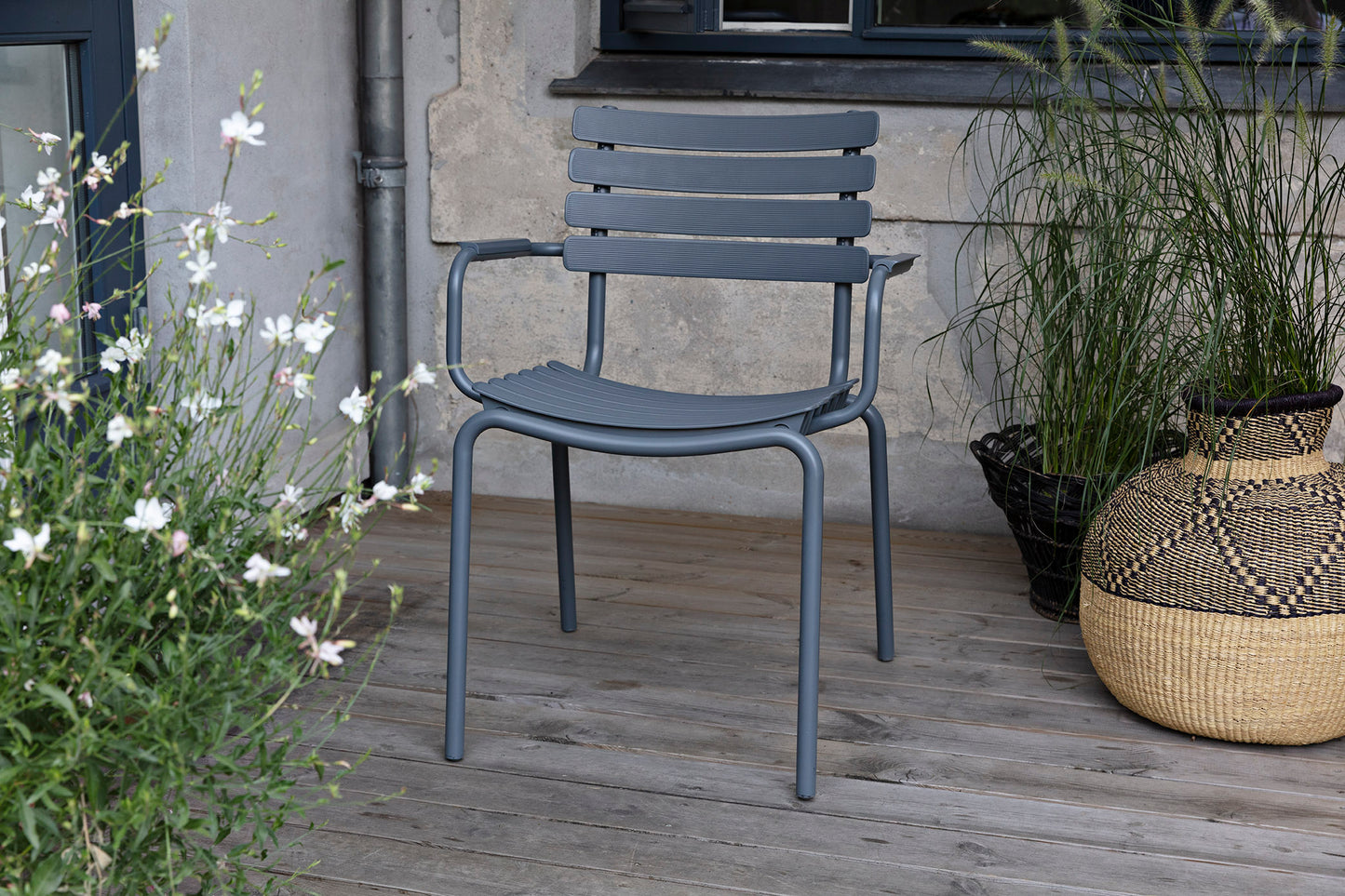 HOUE ReCLIPS dark grey dining chair on wooden deck