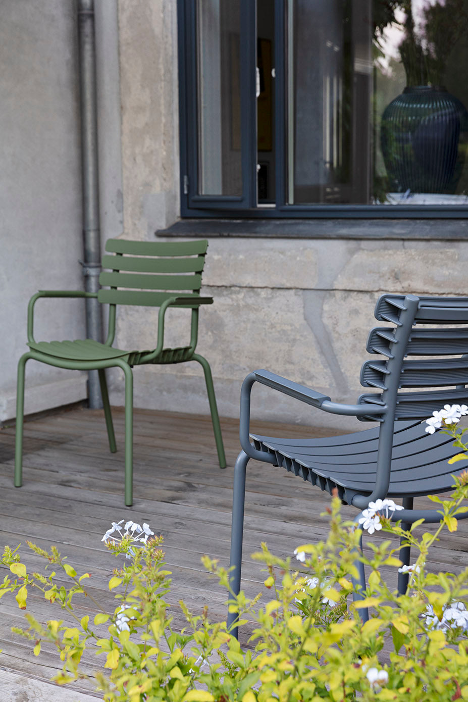 Olive green & dark grey HOUE dining chairs on patio