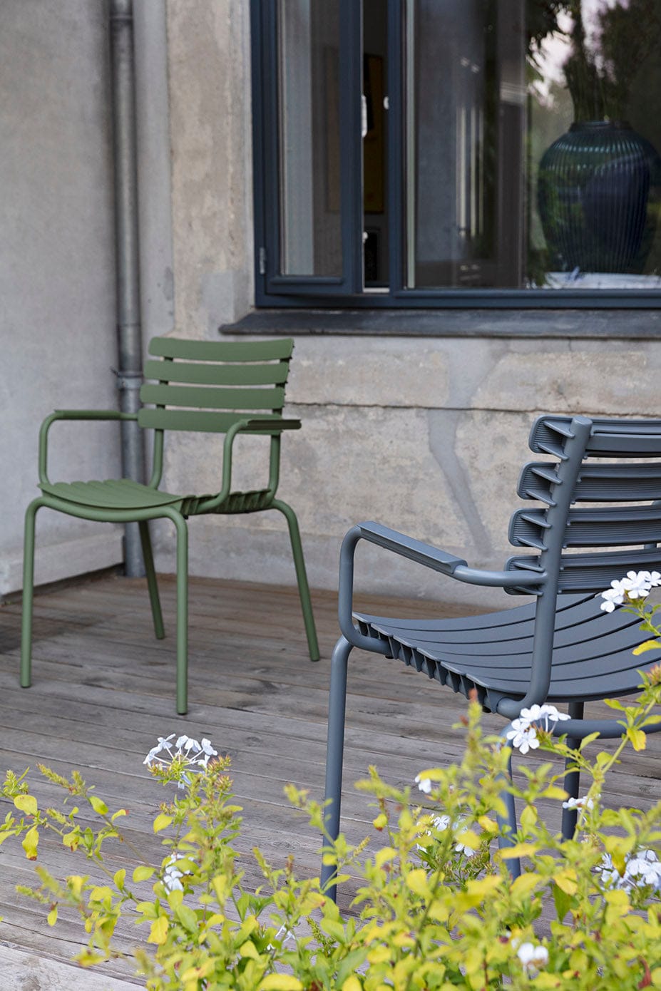 Olive green & dark grey HOUE dining chairs on patio