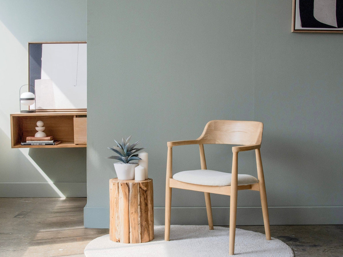 Modern wooden chair with side table and decor