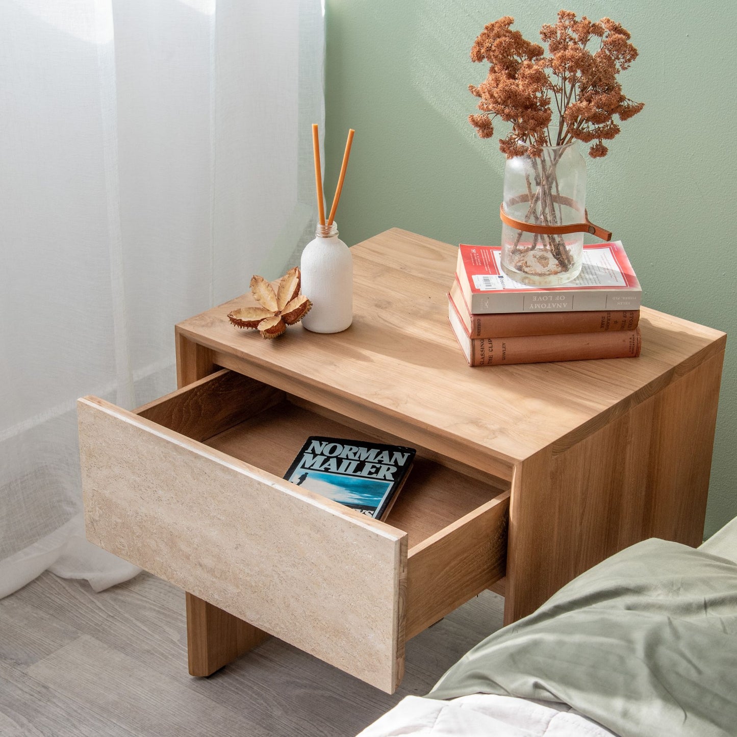 Wooden nightstand with open drawer and decor