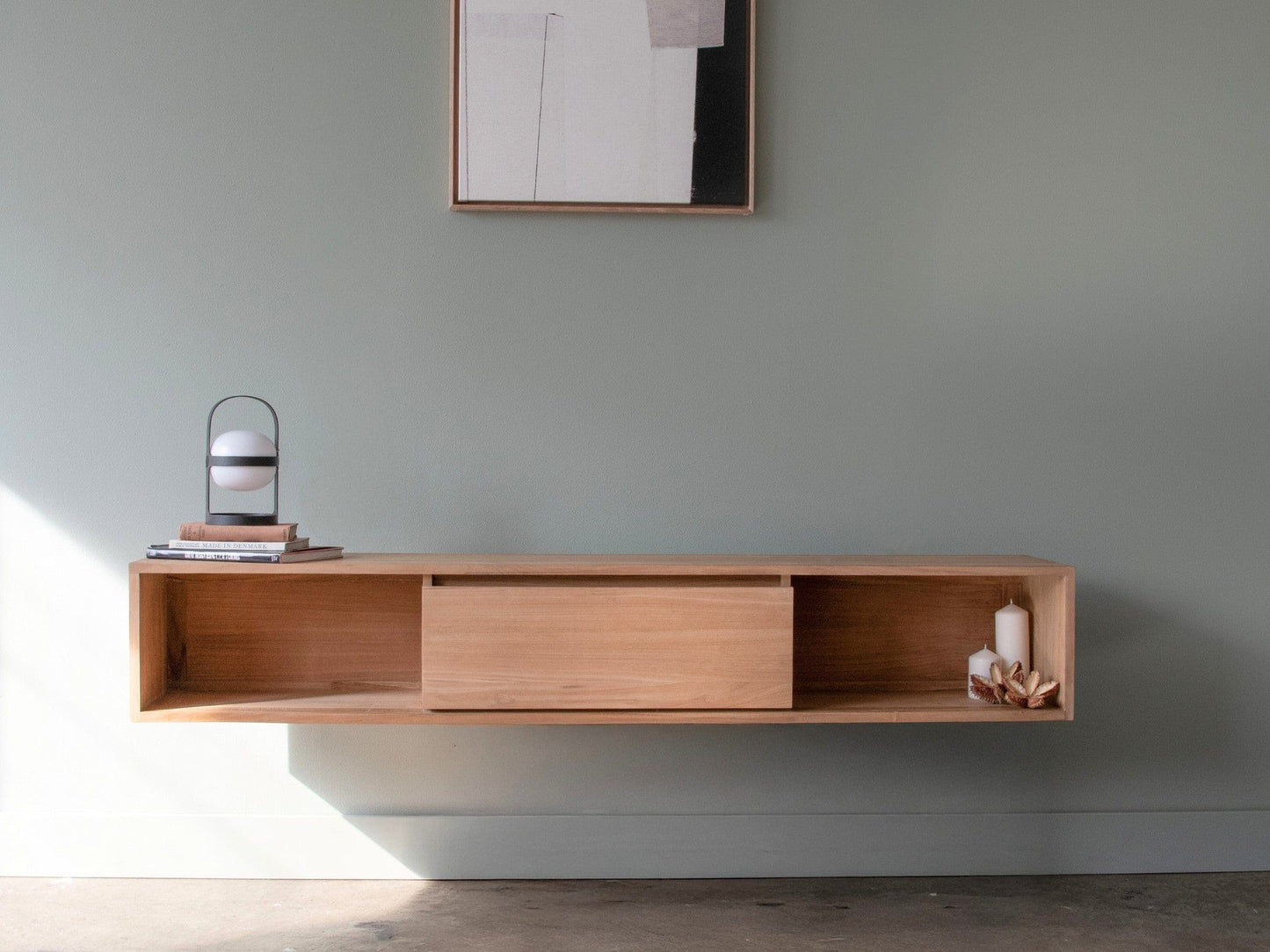 Floating wooden TV console with decor