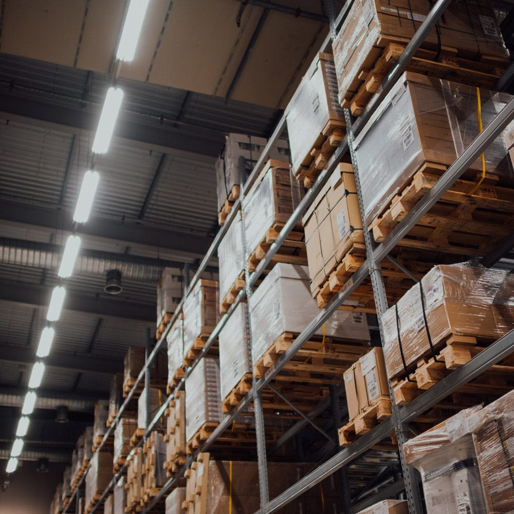 Warehouse shelves stacked with packaged goods