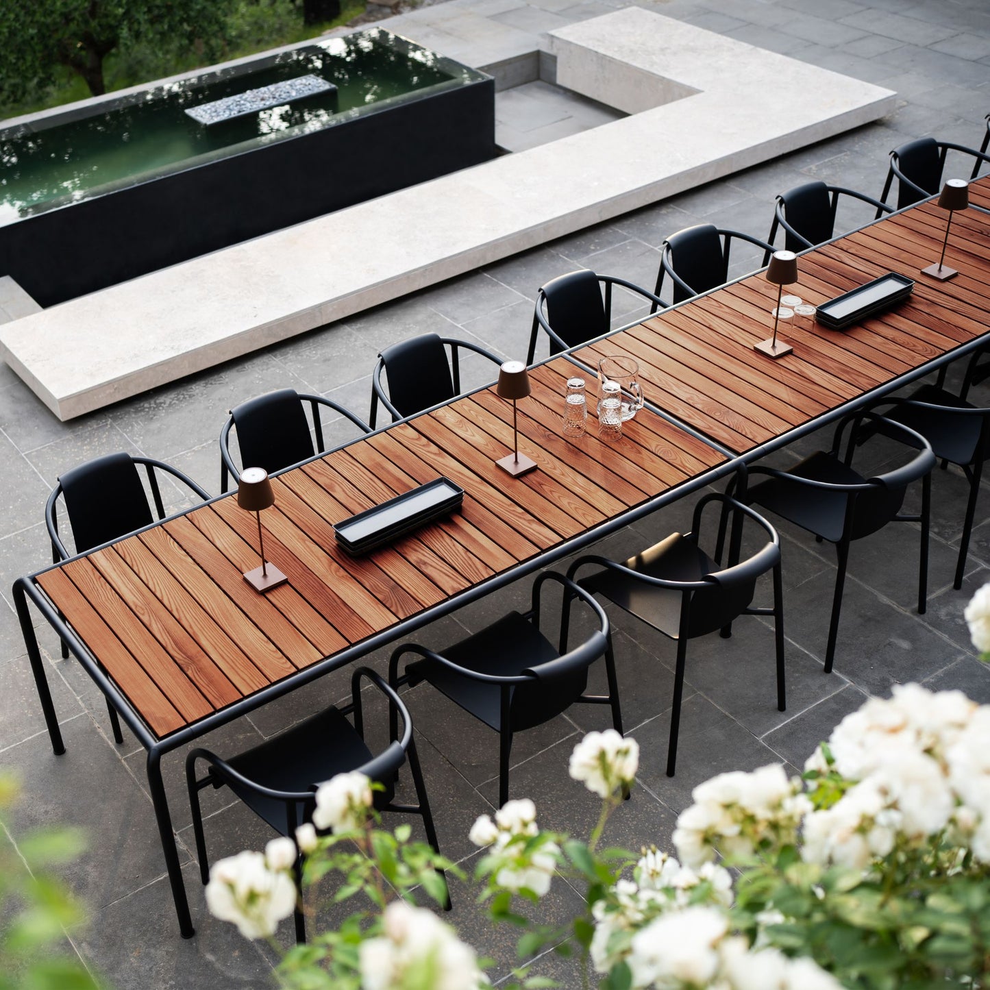 Avantitablehoue outdoor dining table with black chairs