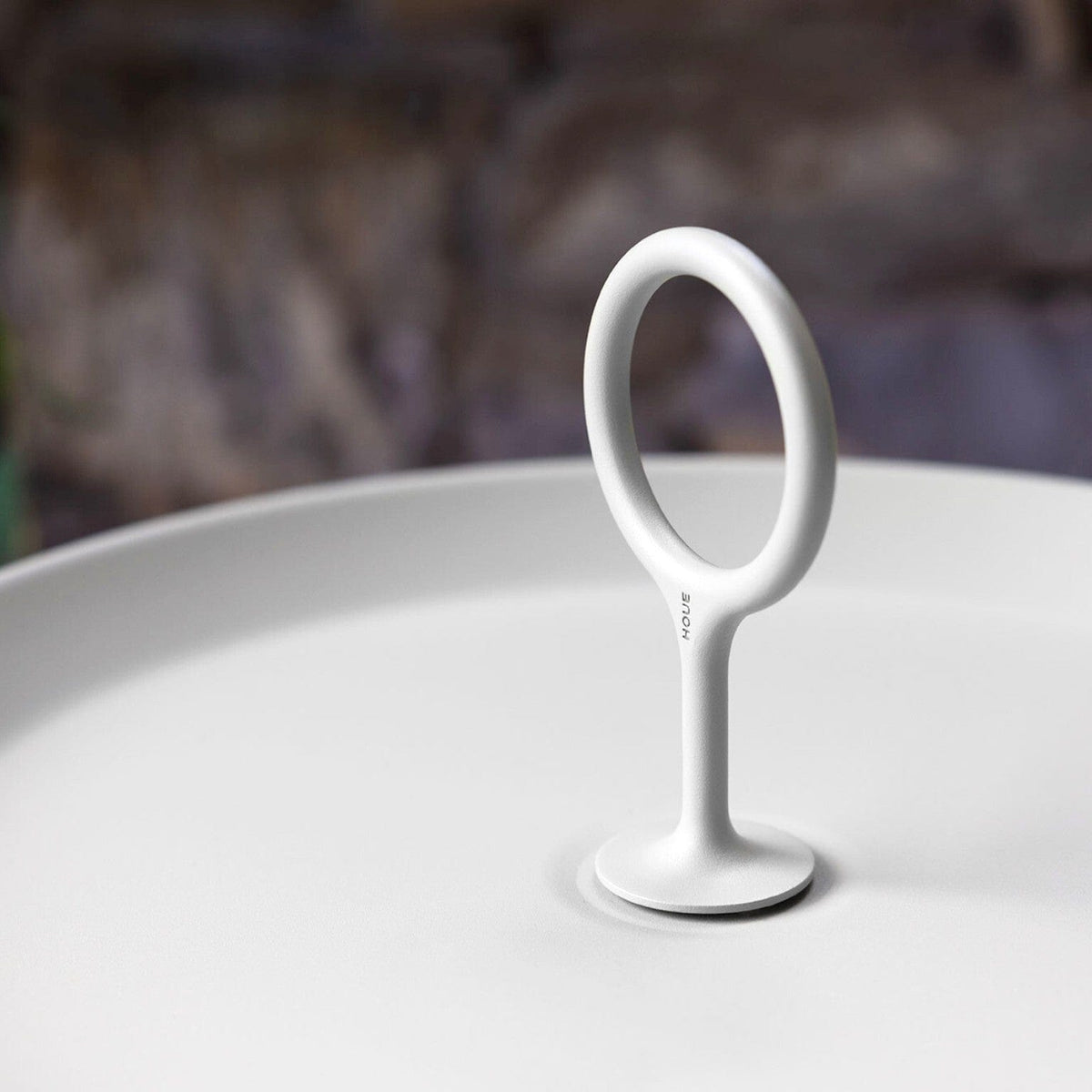 White eyelet handle on muted white plate
