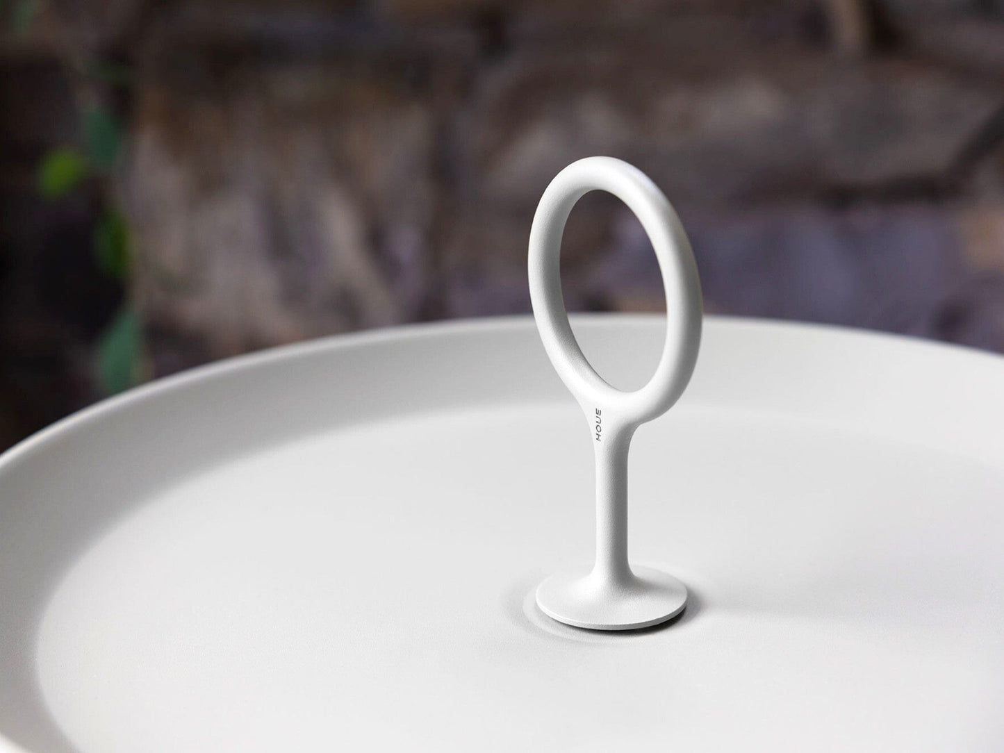 White eyelet handle on muted white plate