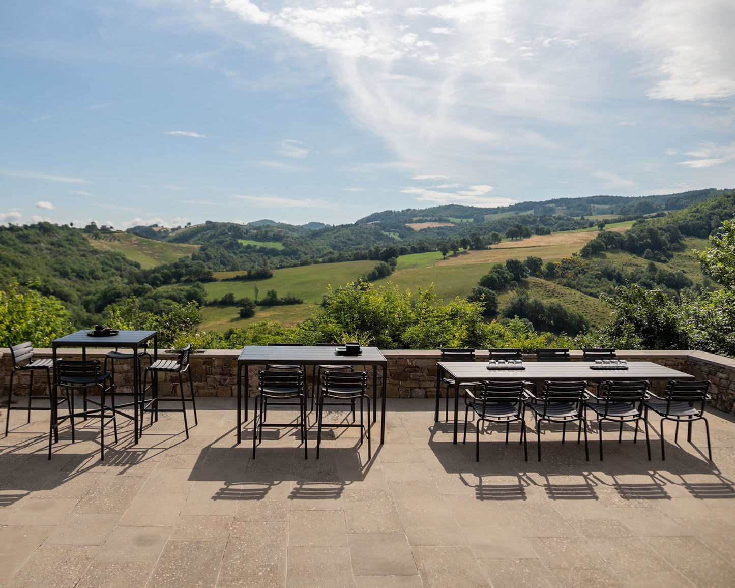 Outdoor dining area with scenic reclips_four_1 landscape view.