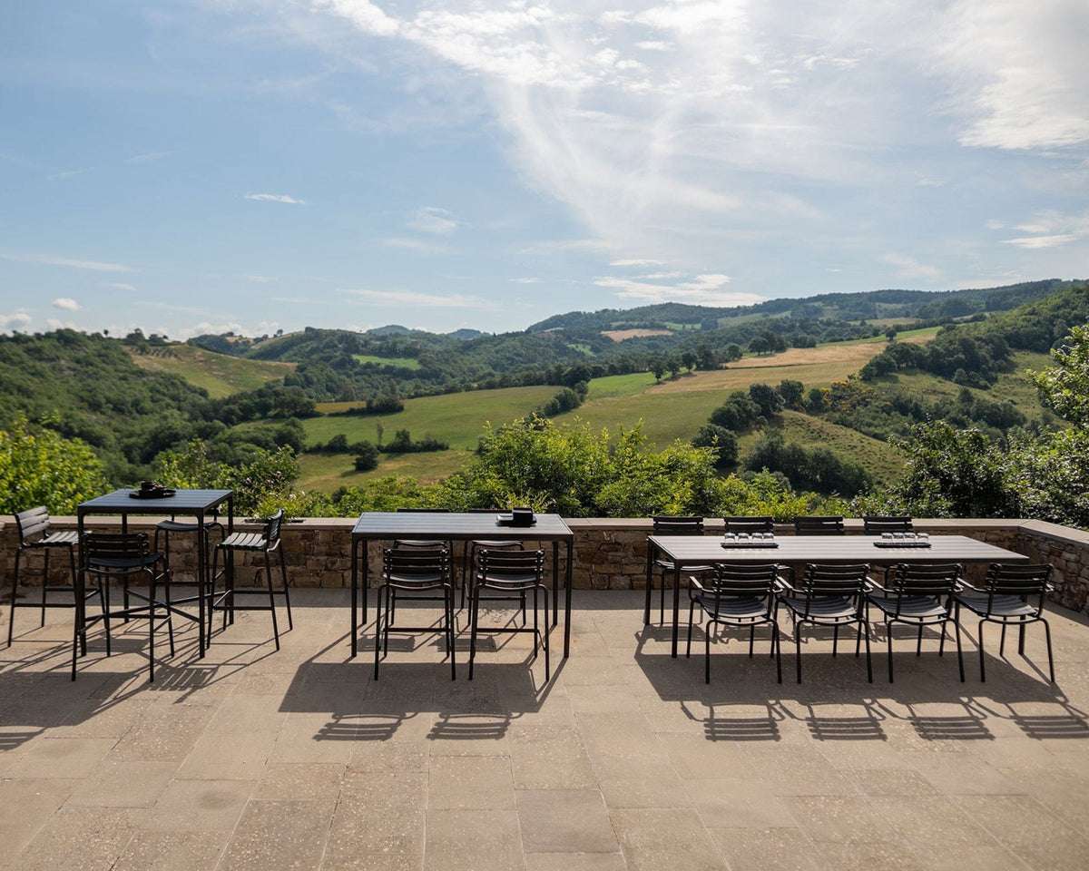 Outdoor dining area with scenic reclips_four_1 landscape view.
