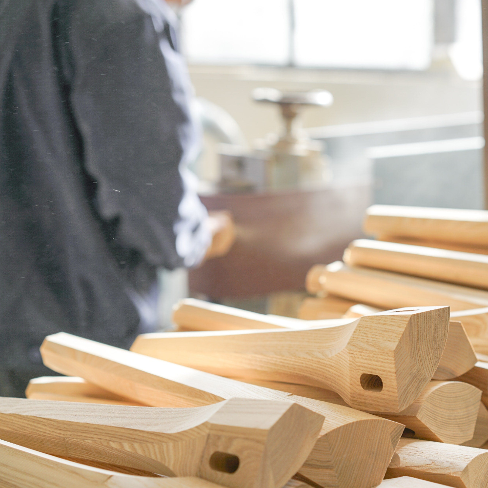 Stack of wooden handles with a blurred background