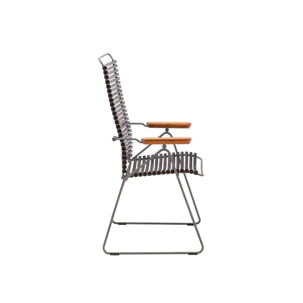 Side view of a black and wood chair.