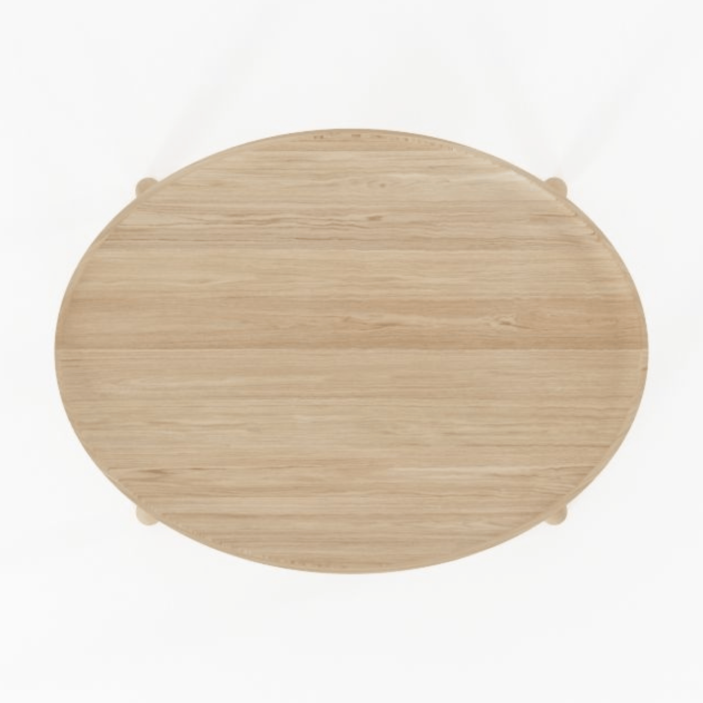 Overhead view of a small, round, wooden table.
