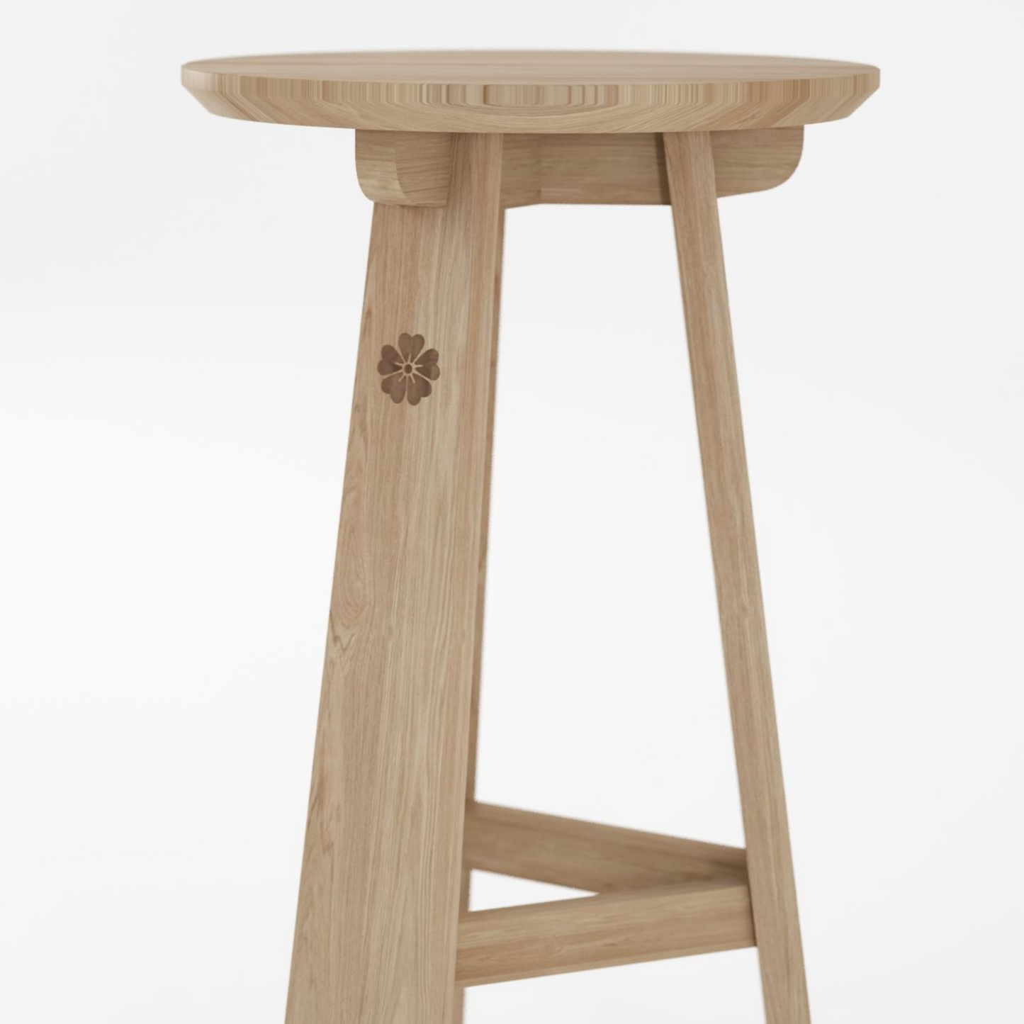 Wooden stool with floral carving.