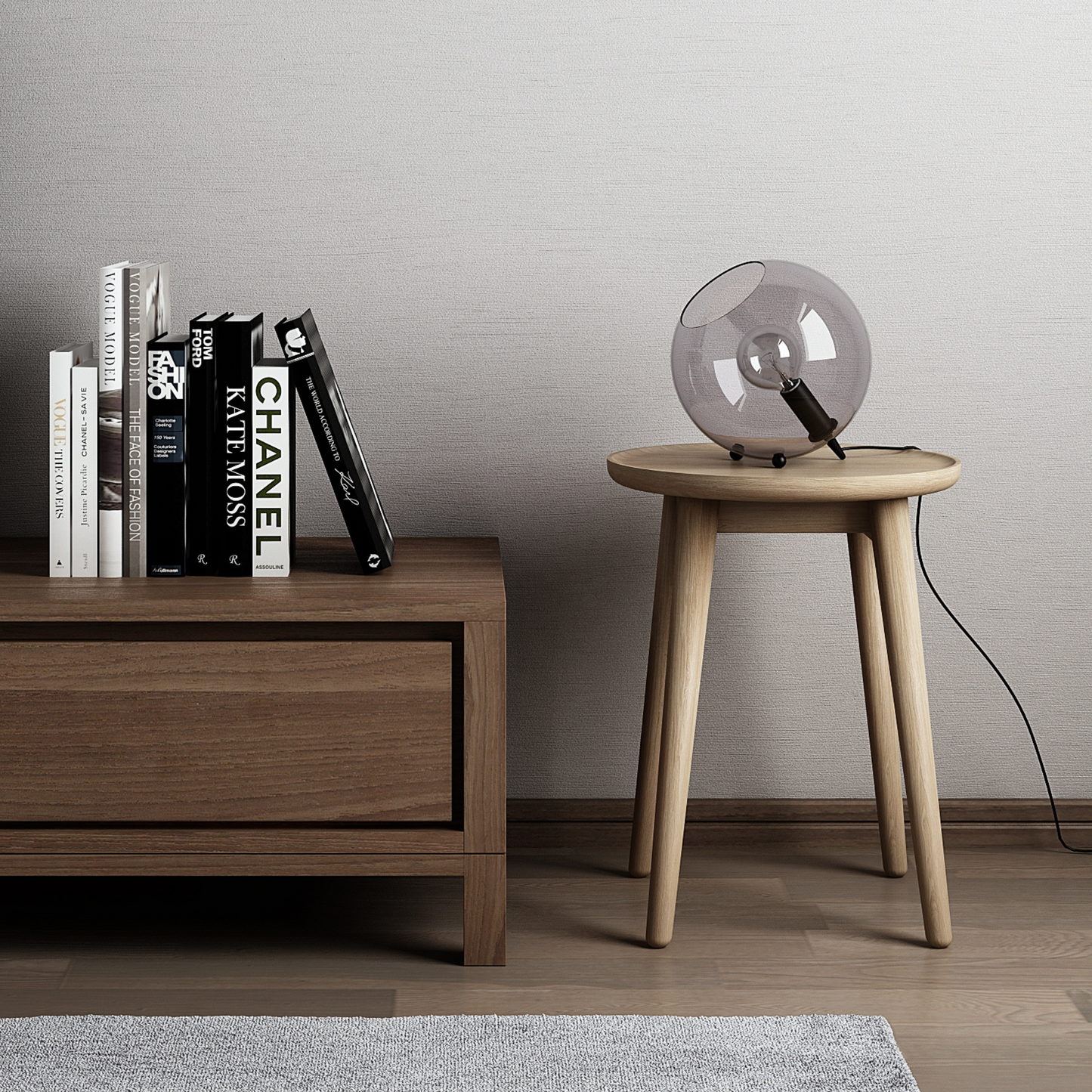 Wooden side table with lamp and books.