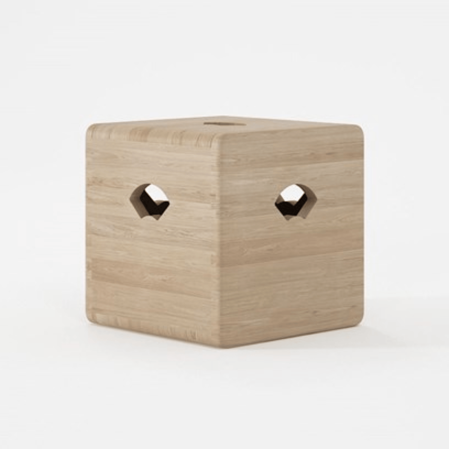 Wooden cube with two diamond-shaped holes.
