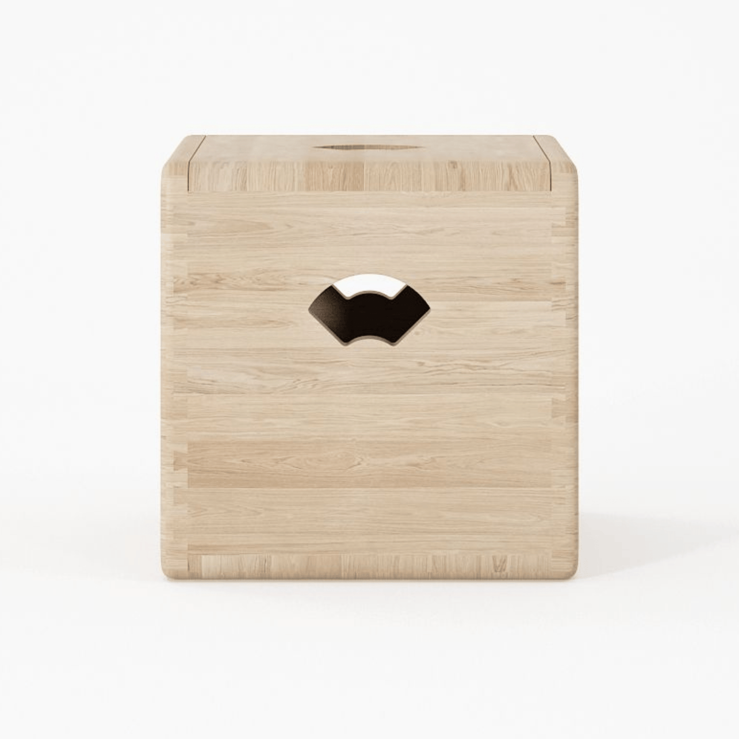 Wooden cube with a cut-out design.