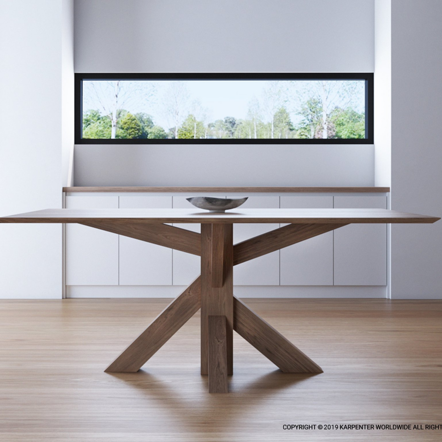 Wooden table with bowl in front of a window.