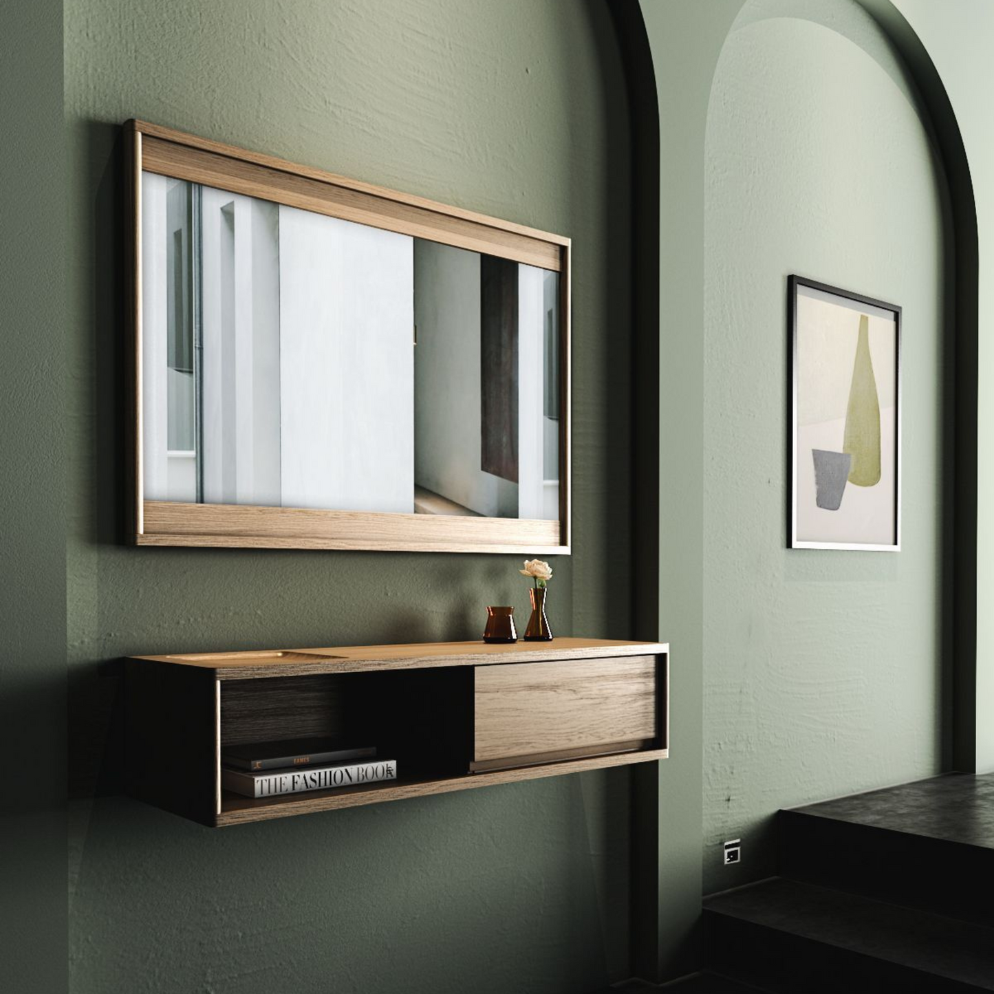Mirror, floating cabinet, and framed art on green wall.