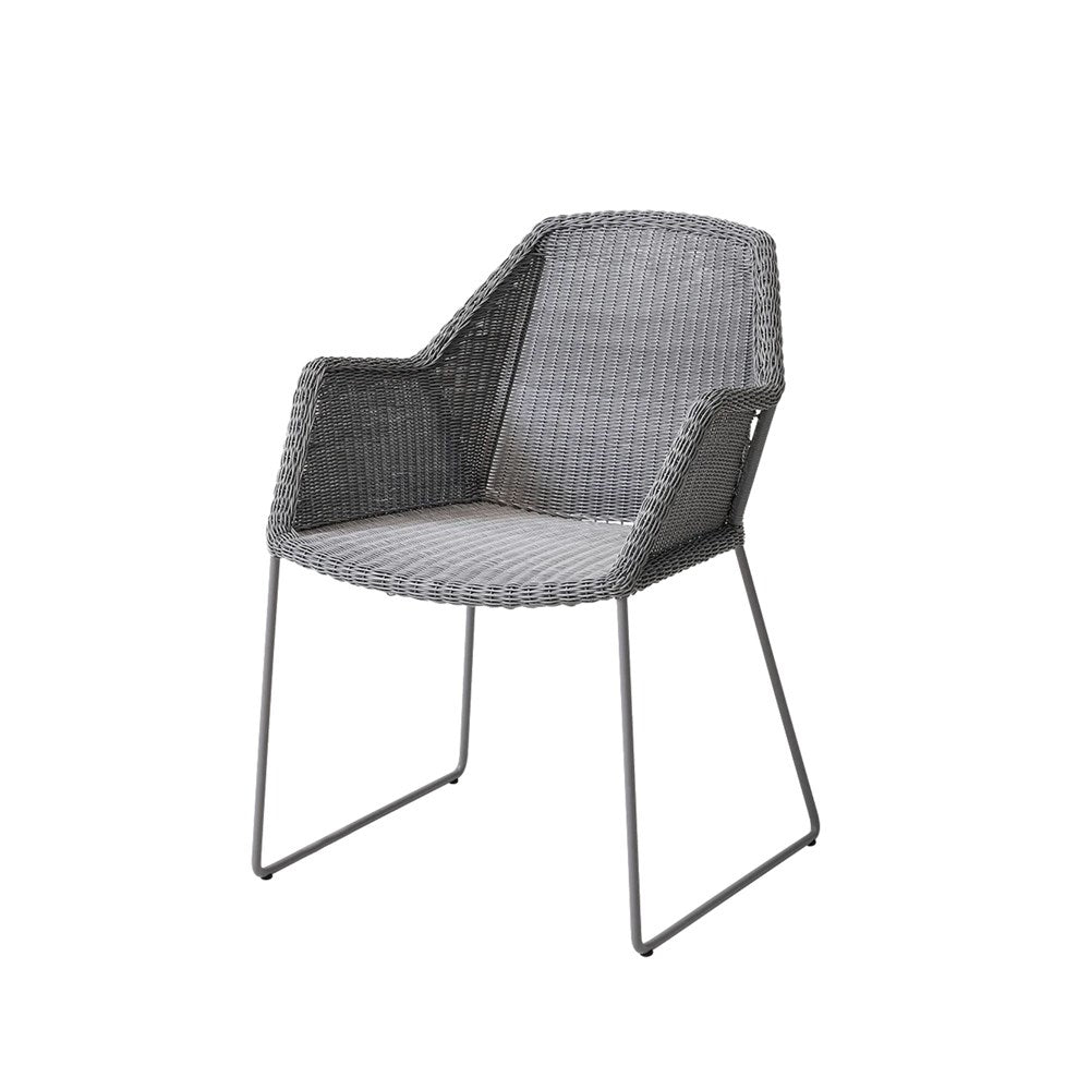 Grey wicker outdoor chair with metal legs