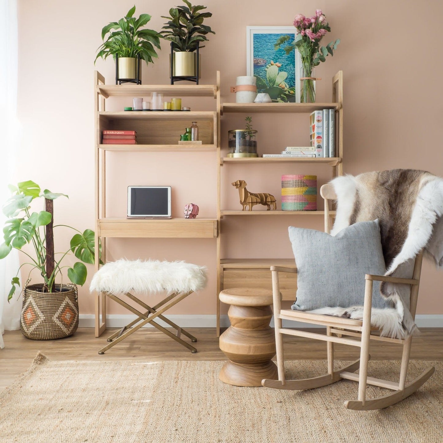 Wooden shelving unit with plants, rocking chair, and decor.