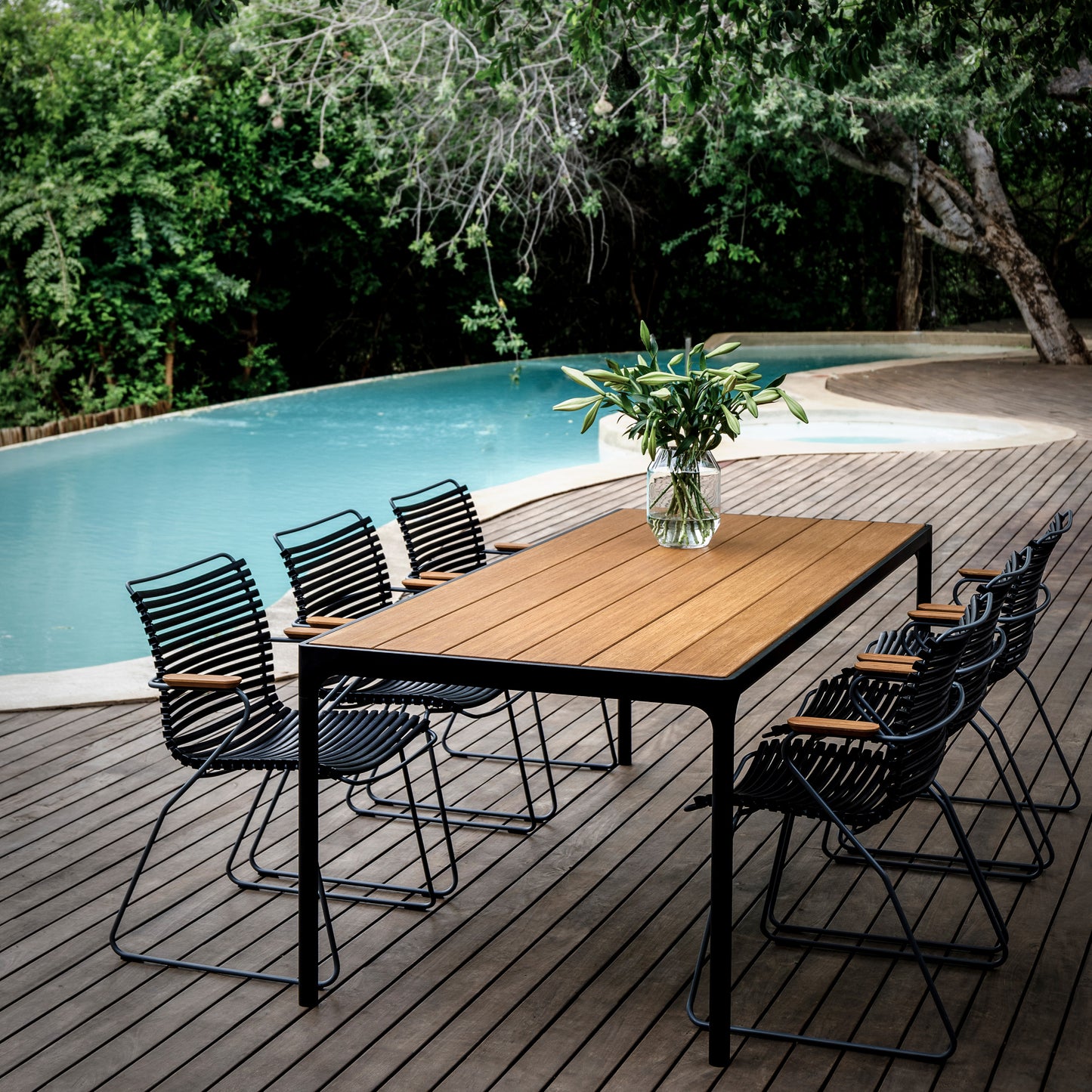 Outdoor dining table and chairs by the pool