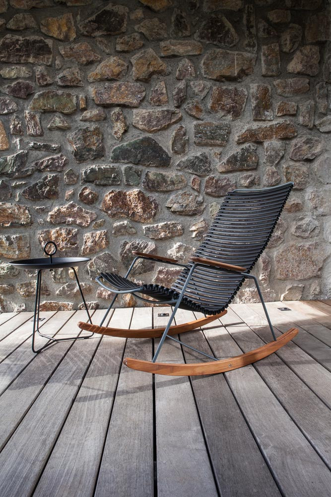 Rocking chair with eyelet detail on wooden deck