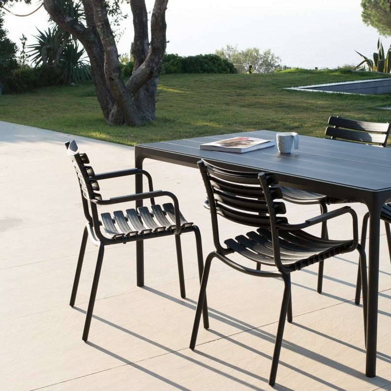 Black dining chairs & table on patio